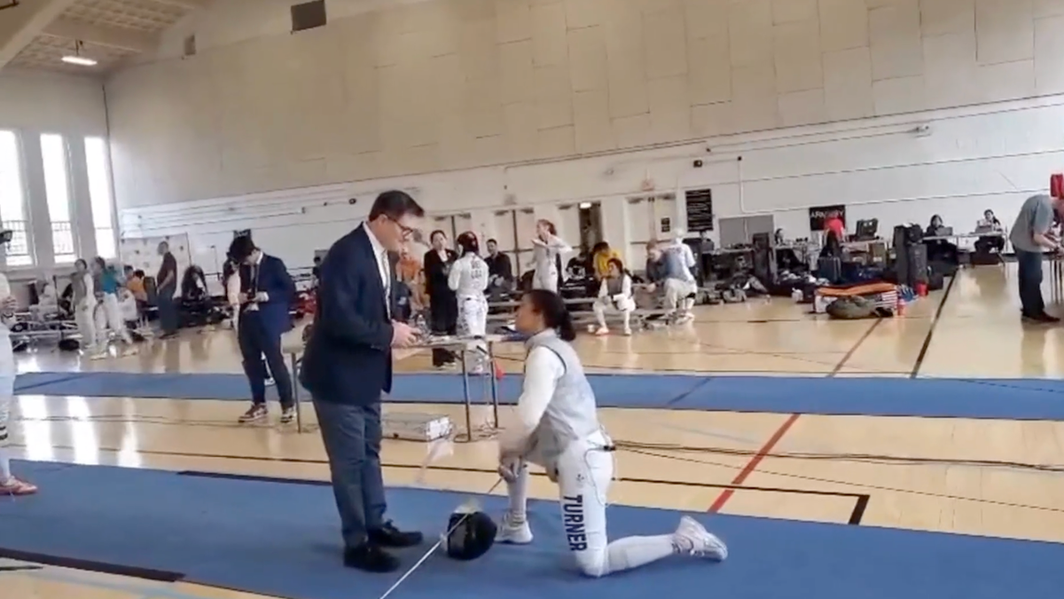 Stephanie Turner kneels